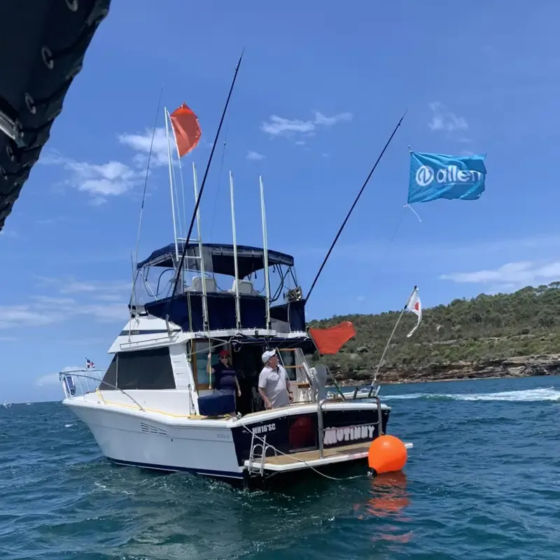 Allen Flag on the Middle Harbour 16ft Skiff Club Start Boat